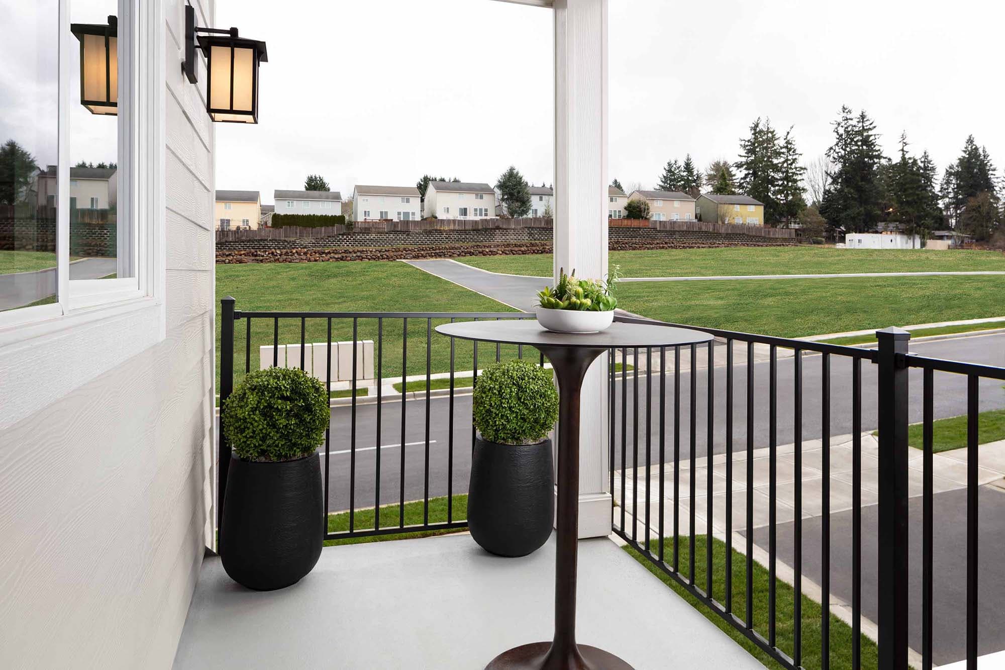 balcony table overlooking greenspace in The Rows at Axiom