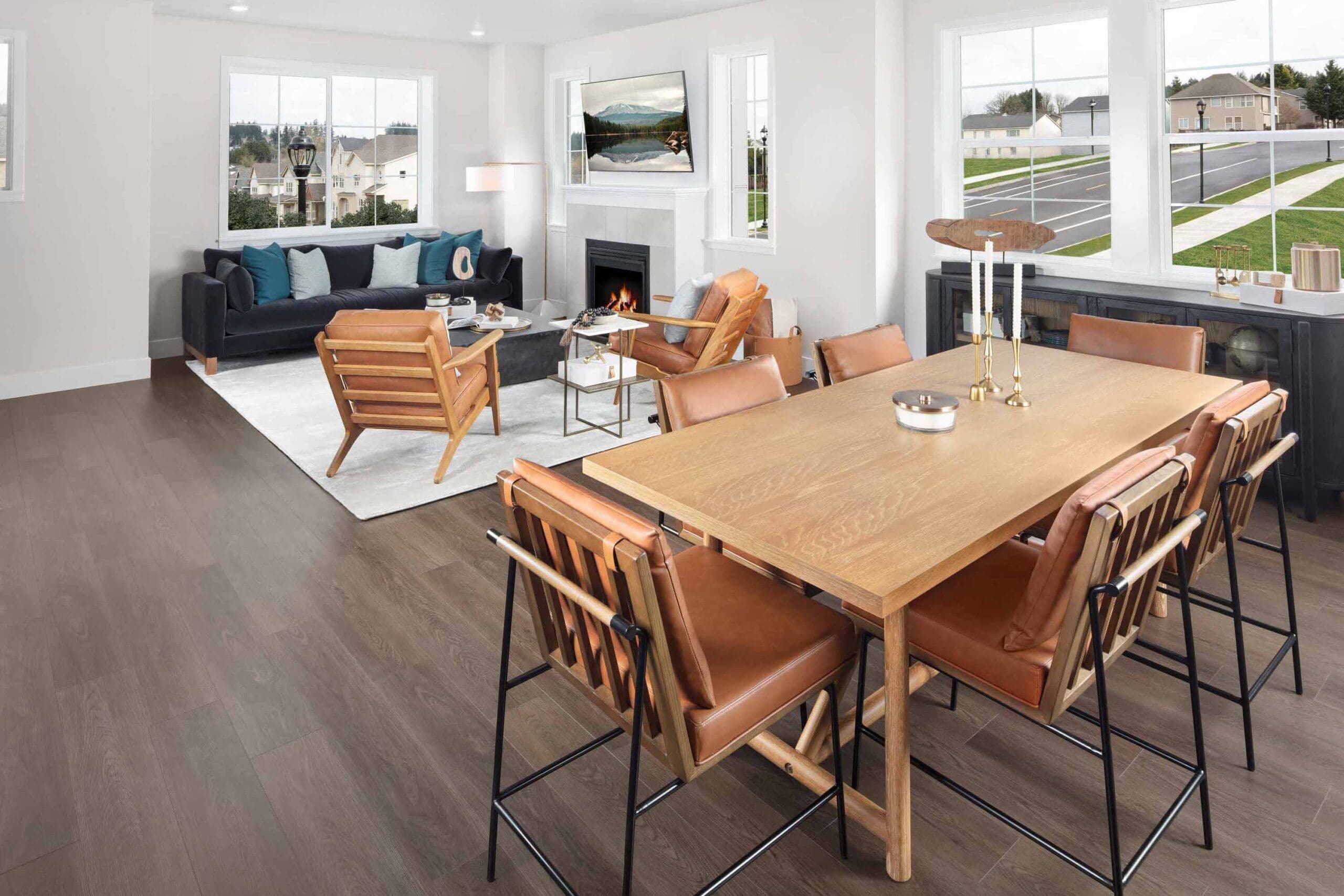 Wooden dining table and cozy functional living room at The Rows at the Axiom