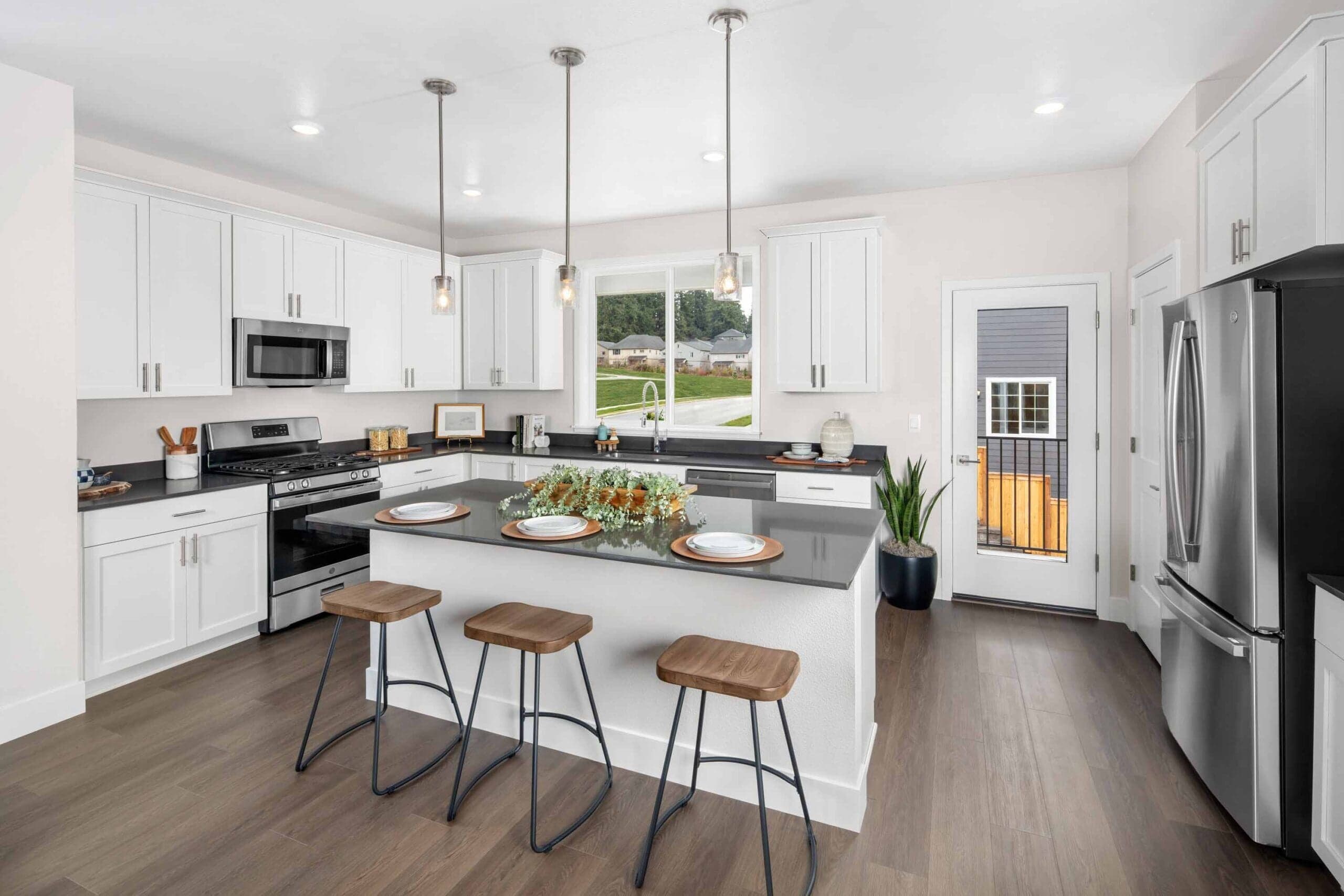 Modern kitchen with island or breakfast bar at The Rows at Axiom