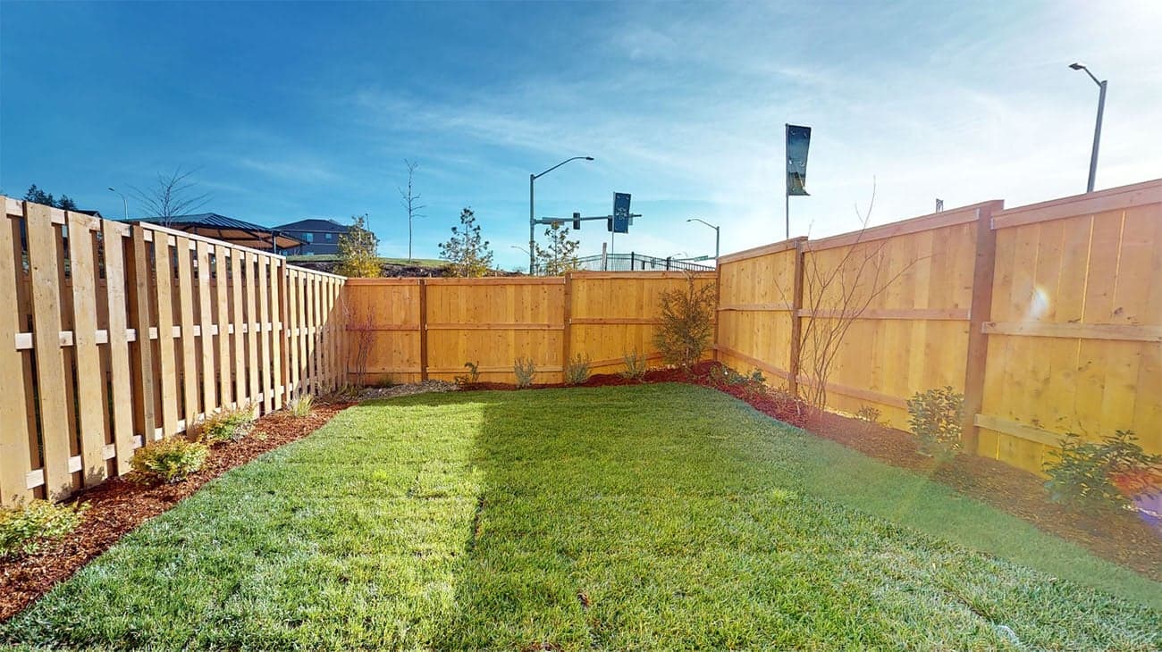 Fenced backyard for added privacy at The Townes at The Vineyard's Rhone floorplan